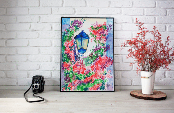 Watercolor canvas print of a glowing blue street lantern surrounded by blooming red, purple, and green flowers, evoking a romantic evening alleyway scene.